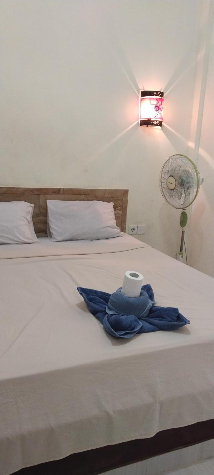 Amed Stop Inn Homestay, Rooftop Restaurant And Bar Экстерьер фото