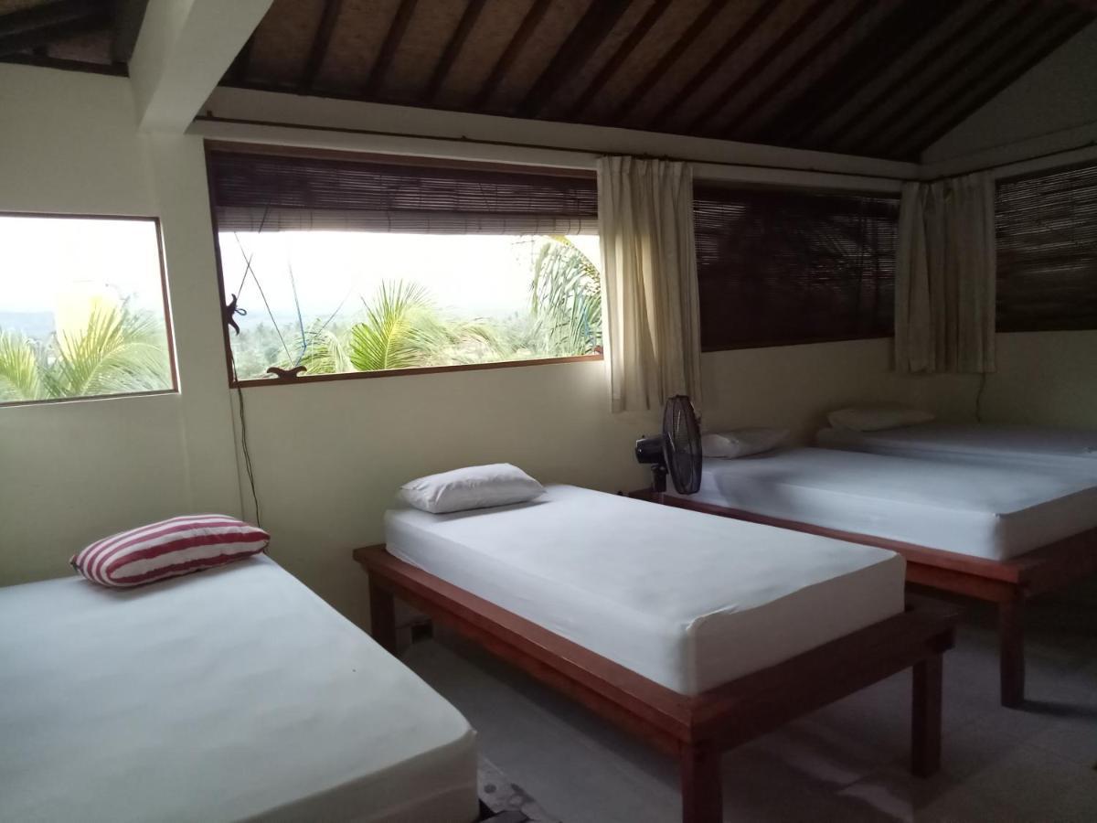 Amed Stop Inn Homestay, Rooftop Restaurant And Bar Экстерьер фото